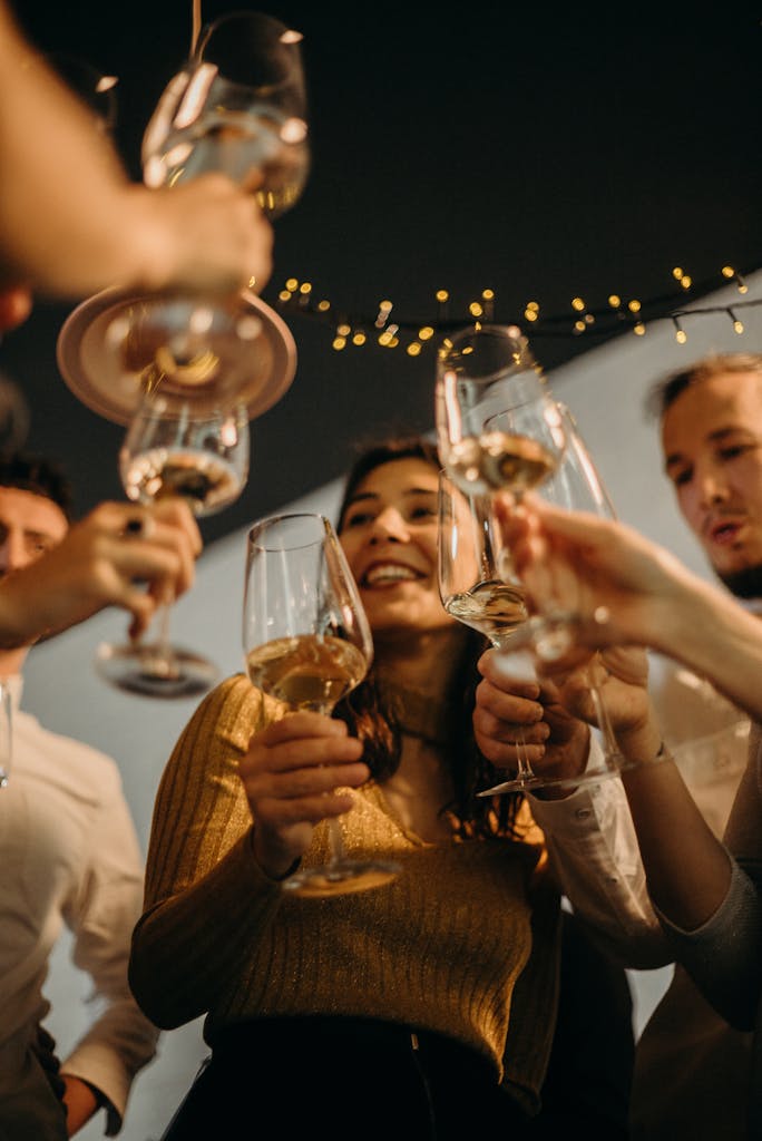 People Cheering With Wine Glasses